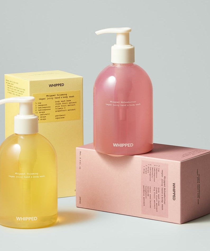 Two bottles of WHIPPED Yujamong Vegan Juicy Hand & Body Wash 290ml with packaging.